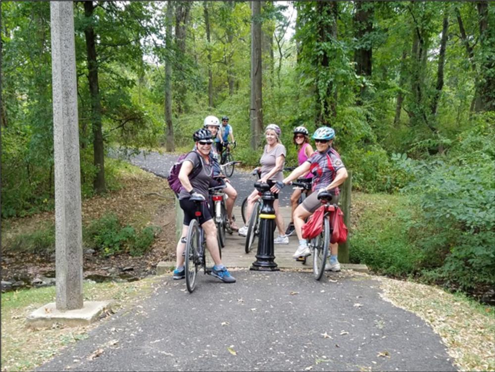 A group of bikers gathered on the Lawrence Hopewell Trail near Princeton