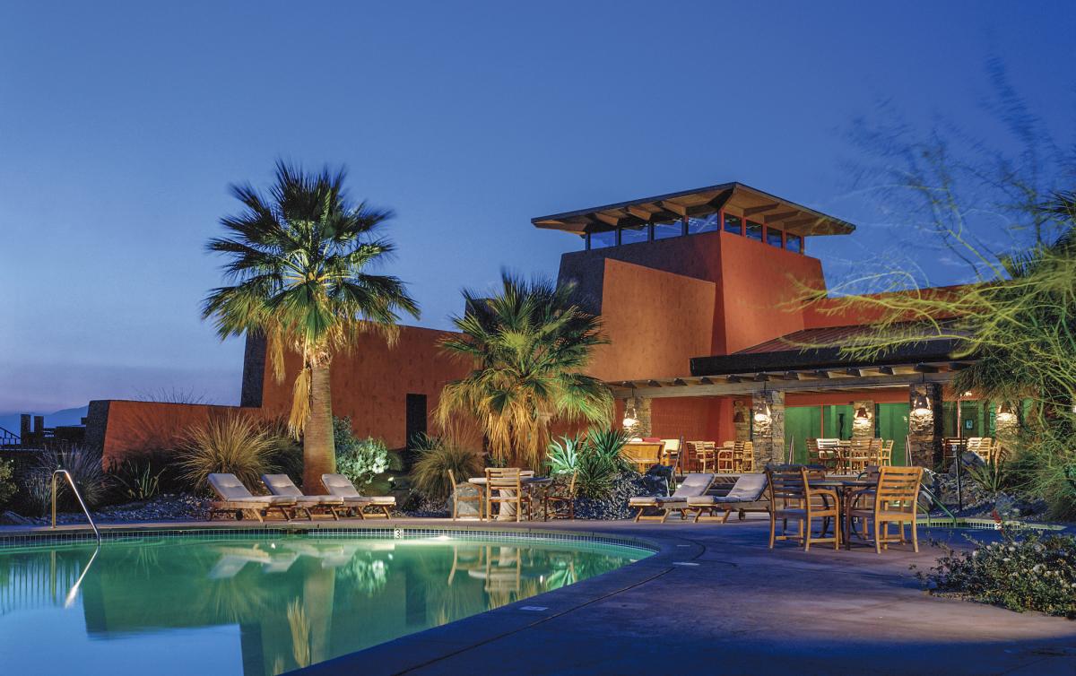 Pool lit up at night at Embarc Palm Desert