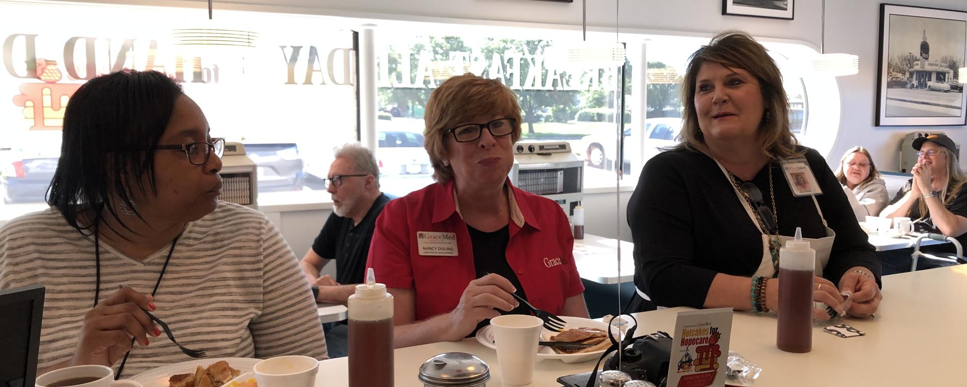 North-ladies at counter Visit Wichita
