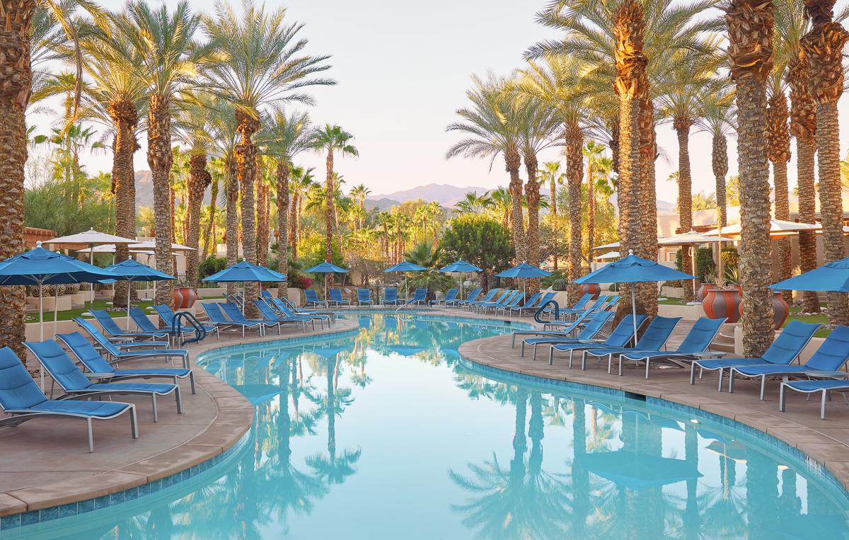 Pool surrounded by palm trees at Hyatt Regency Indian Wells