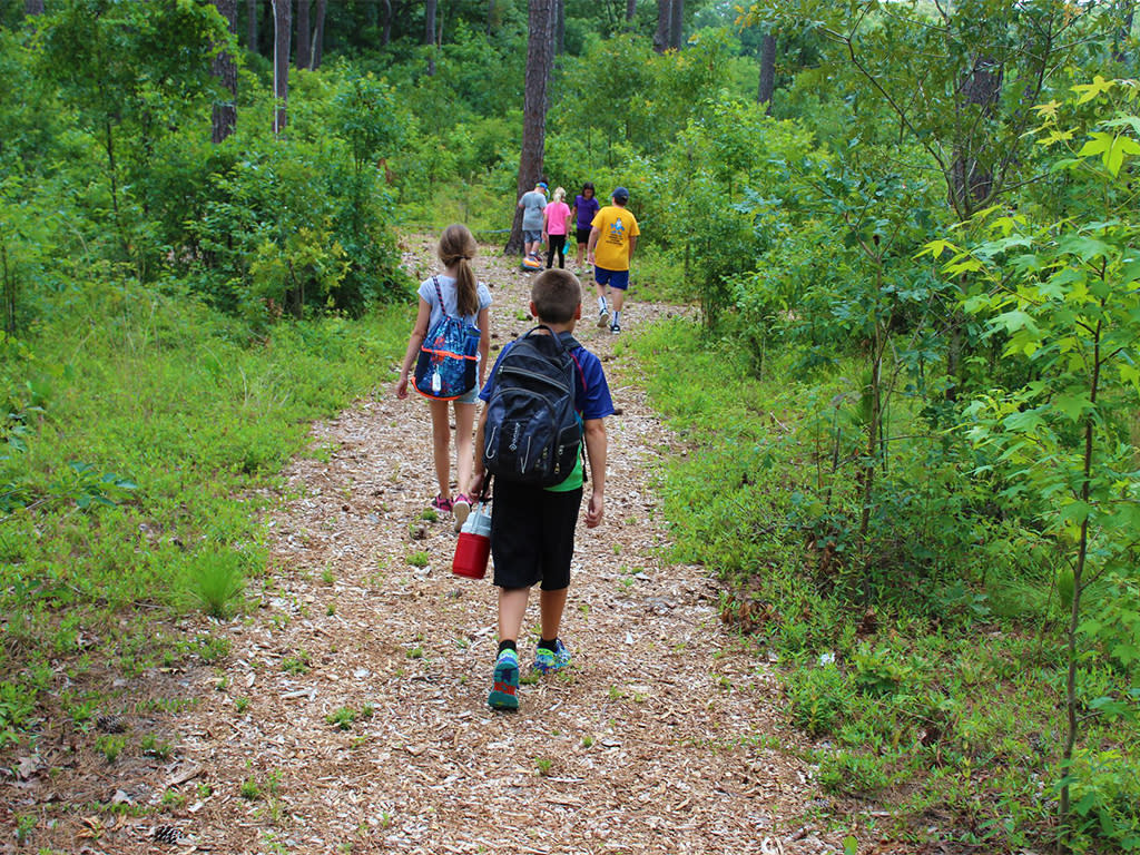 Howell Woods Summer Camp hiking trails and other fun activities.