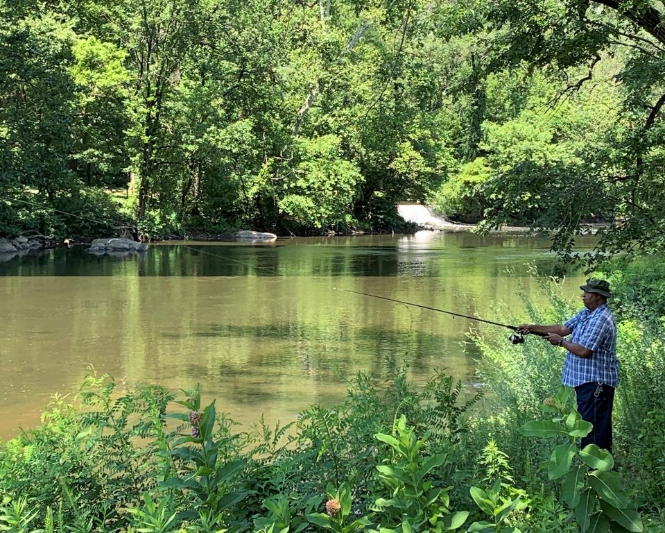 Fishing in the Brandywine Creek, along the trail.