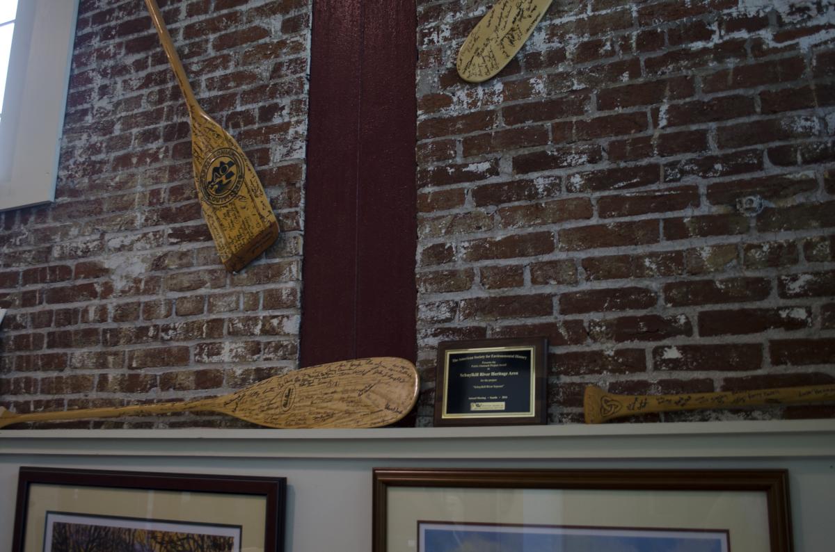 Autographed paddles from every Schulykill River Sojourn adorn the walls of the Heritage Area office.