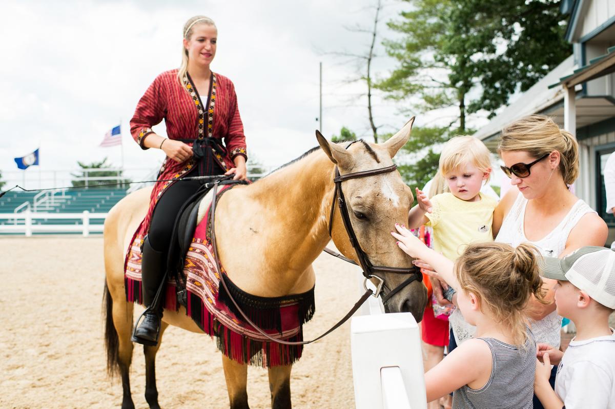 Kids petting horse at the Kentucky Horse Park.