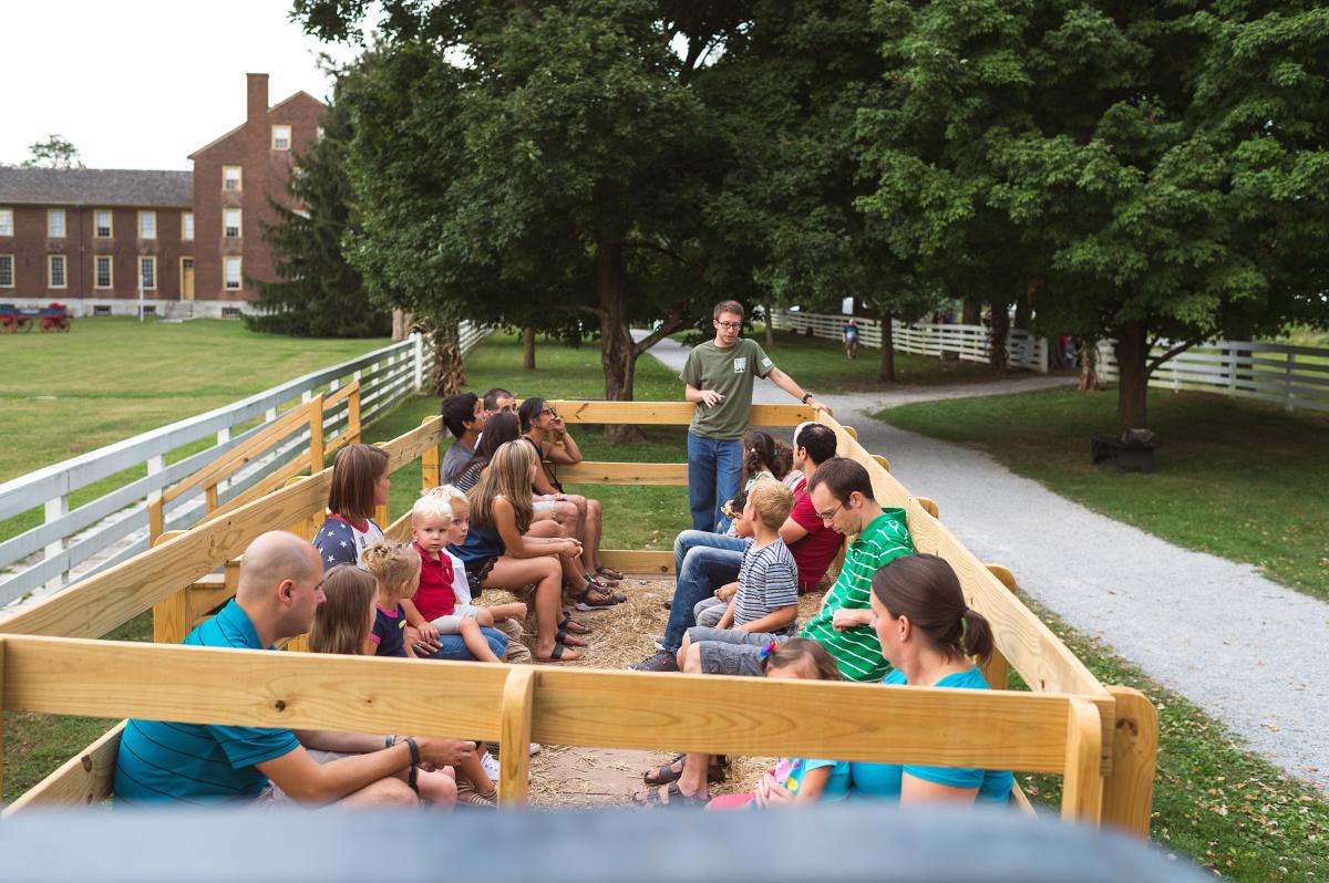 People enjoying a wagon ride at Shaker Village of Pleasant Hill