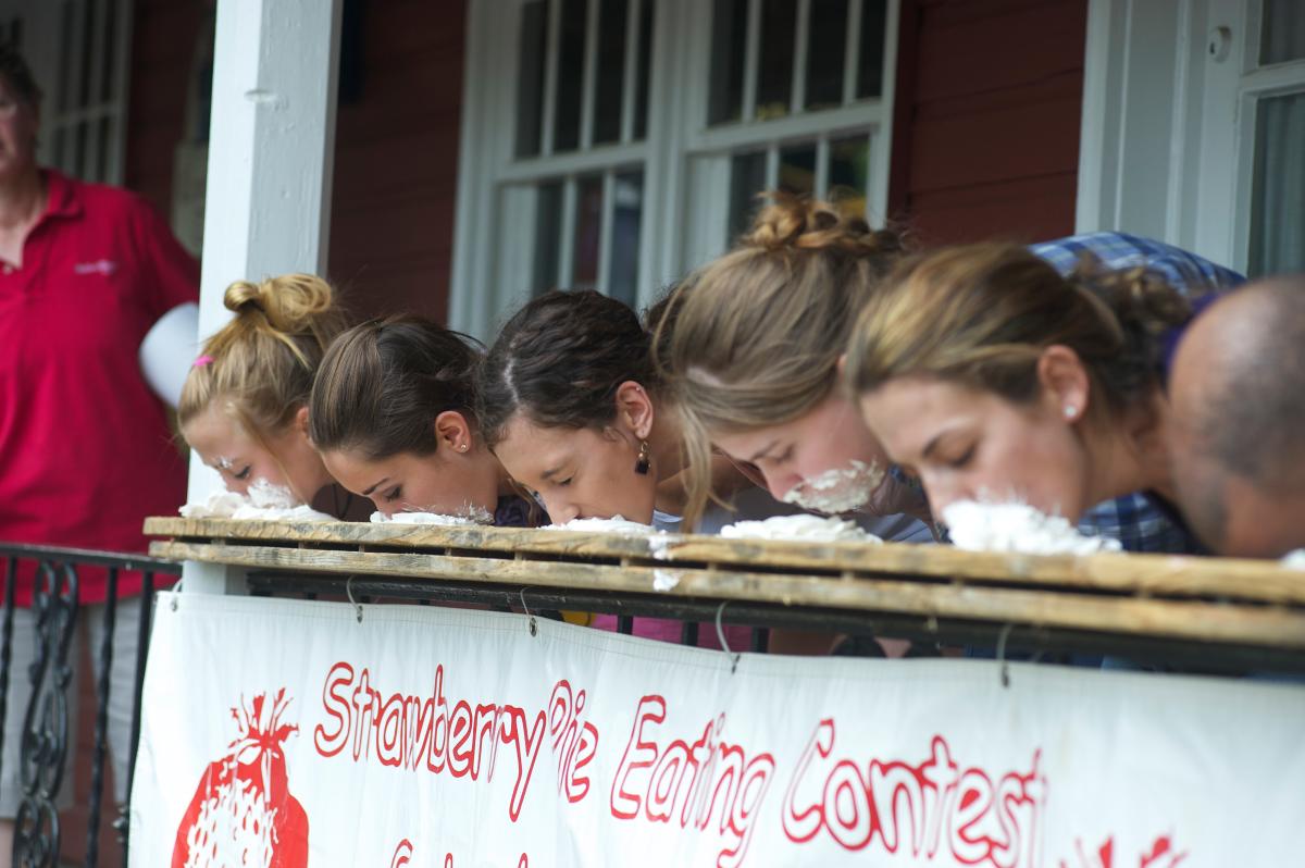 Competitors race to finish their sweet strawberry pies at the annual Strawberry Festival at Peddler's Village, a 42-acre shopping village that hosts special events throughout the year.