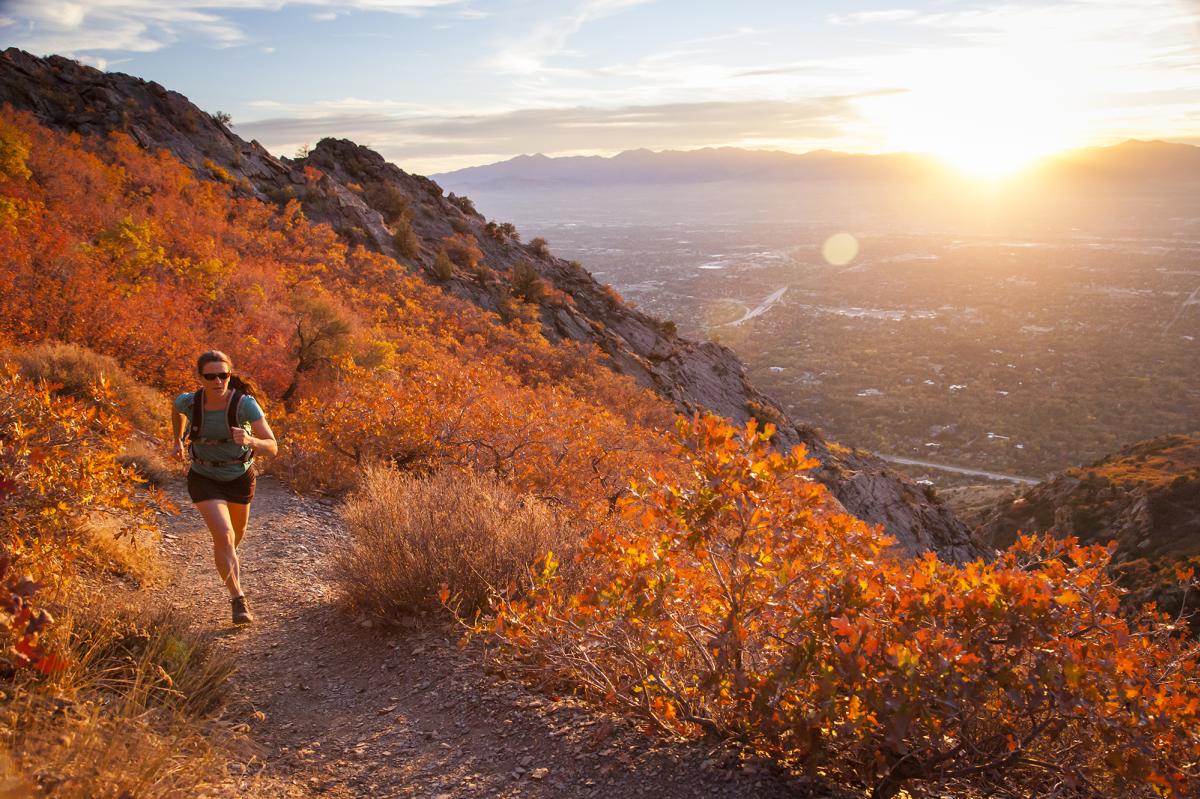 Women running up the Mount Olympus trail in the Autumn.