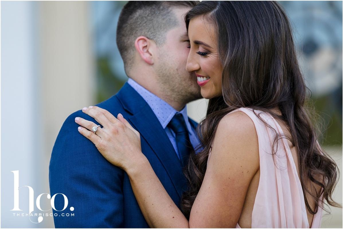 Man kissing fiance on cheek in Saratoga Springs