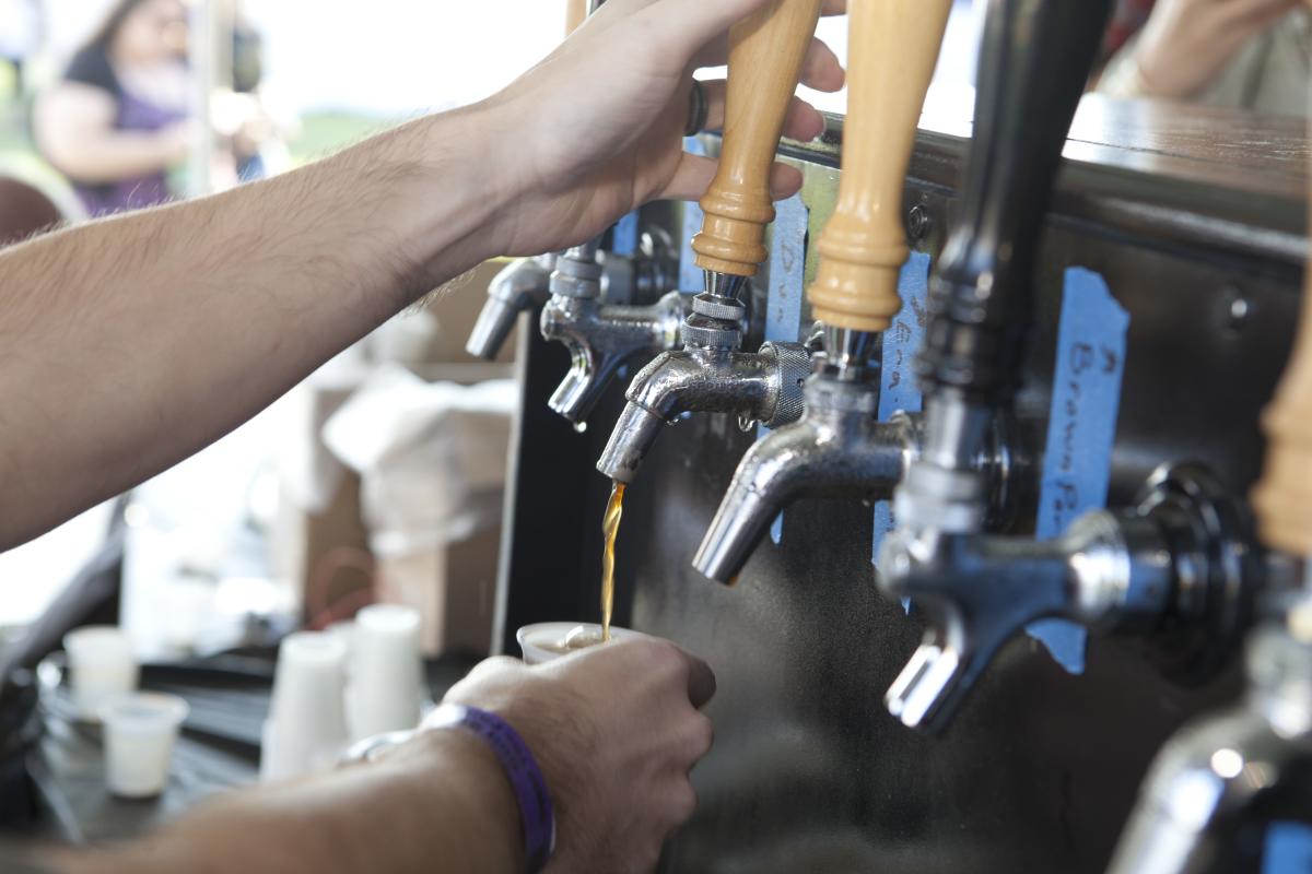 A Bartender pours a fresh glass for guests at Gulf Brew