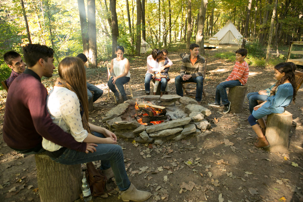 Gather with friends and family by the camp fire