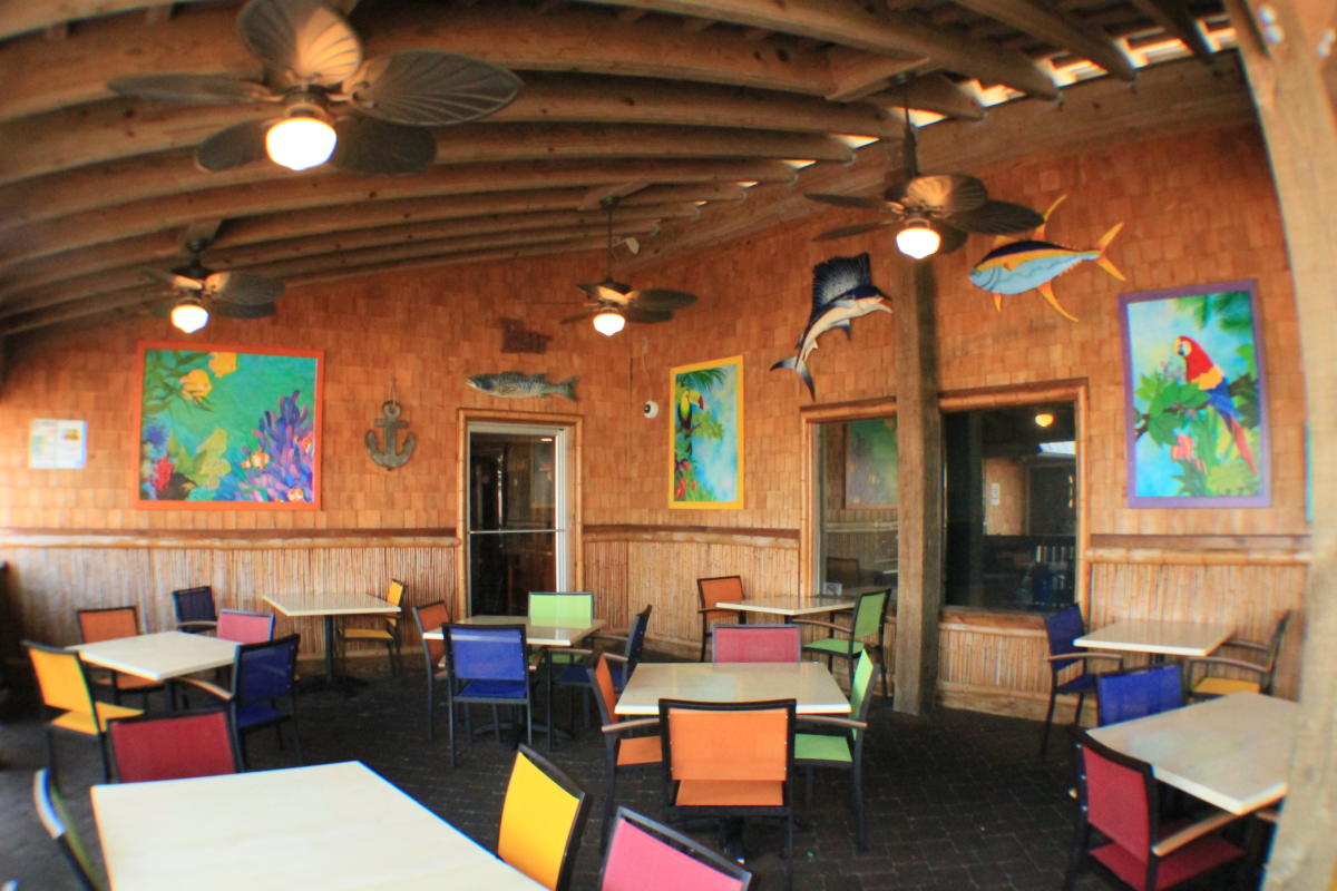 Tables and colorful chairs in Jack Mackerel's Island Grill