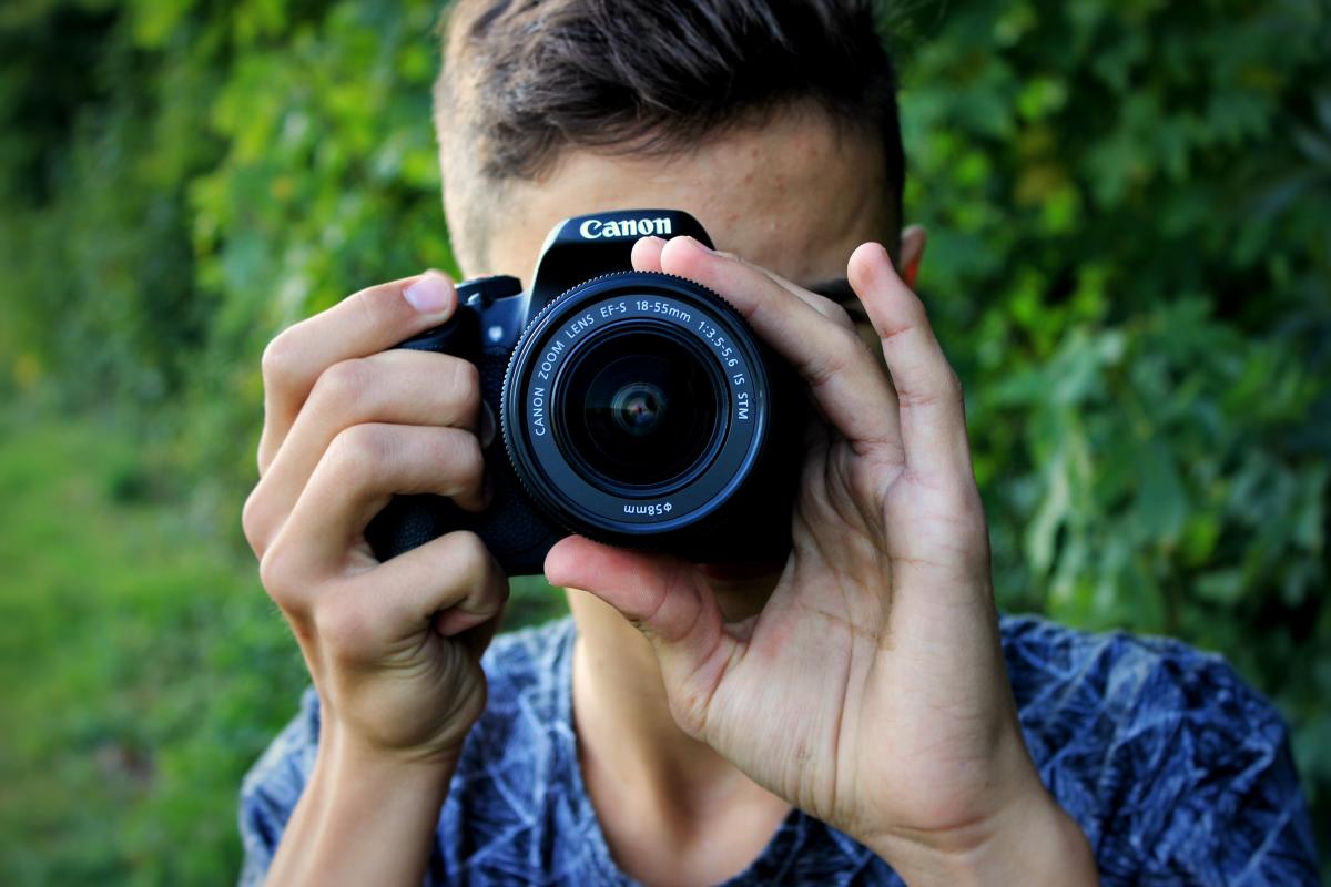 Person Holding Camera