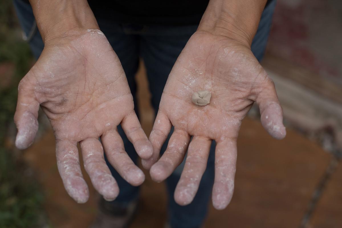 Artist Rose Simpson forming clay