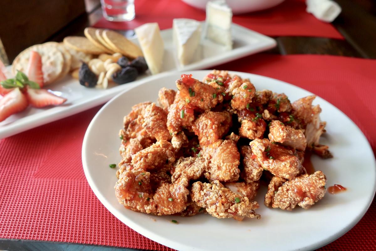 Plate full of golden crisp chicken from Chicken Ranch.