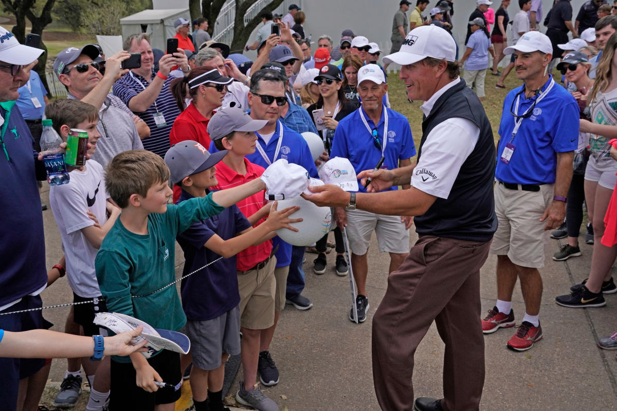 Phil Mickelson signs autographs at the Dell Match Play golf tournament in Austin texas