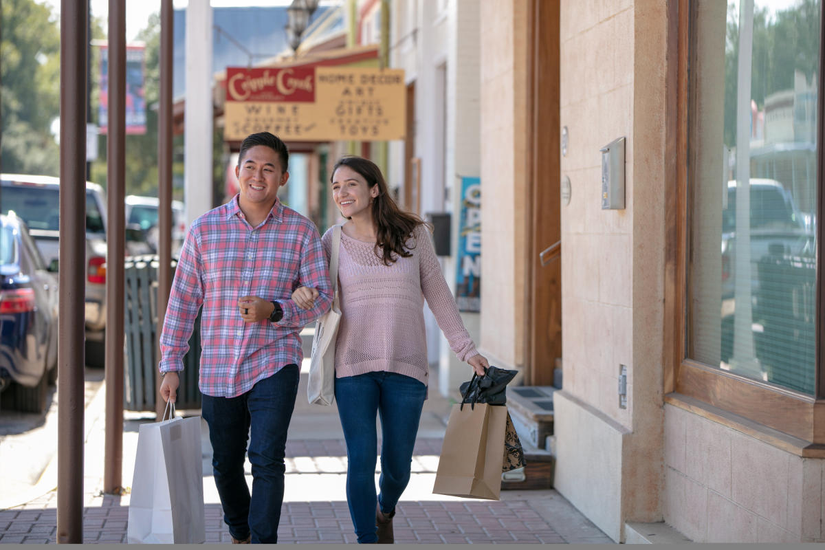 Couple Walking Downtown Bastrop Shopping 