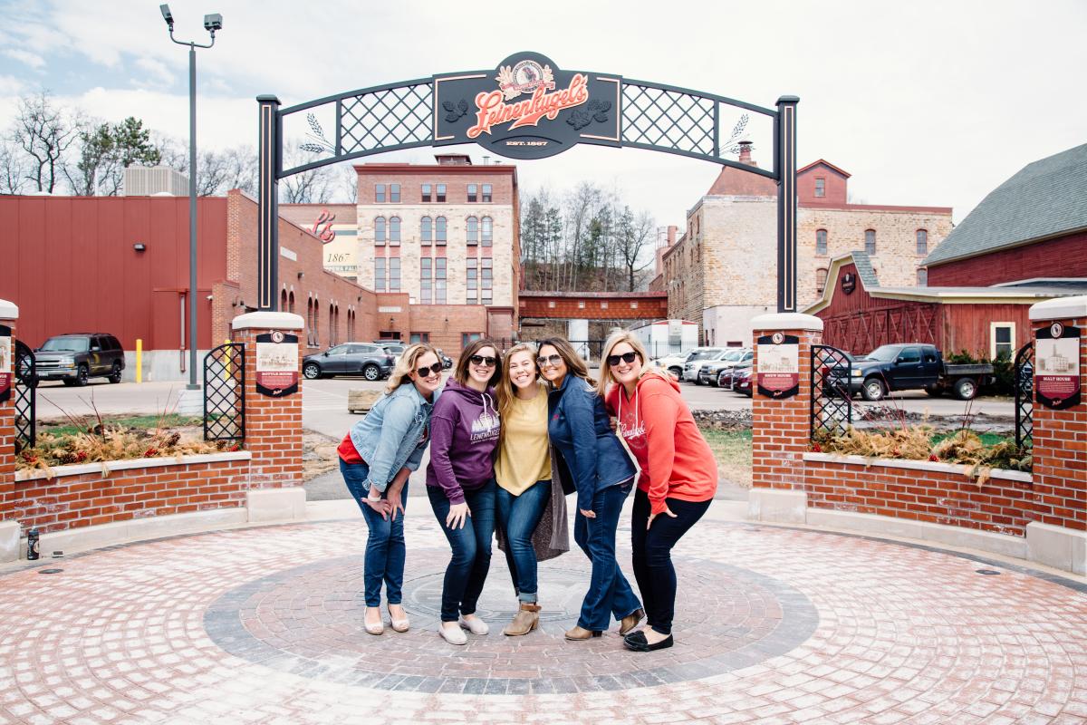 5 Women Posing In Front Of Leinenkugel's Brewery in Chippewa Falls, WI