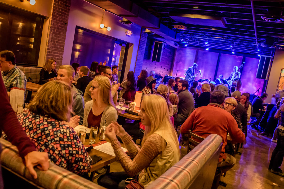 People listening to live music at the Lakely in downtown Eau Claire