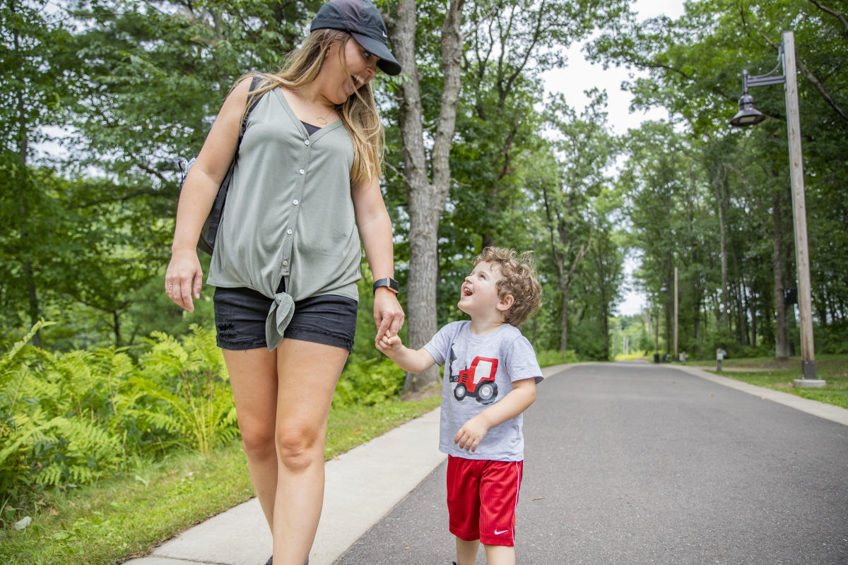 Mom and son walking down the trail at River Prairie