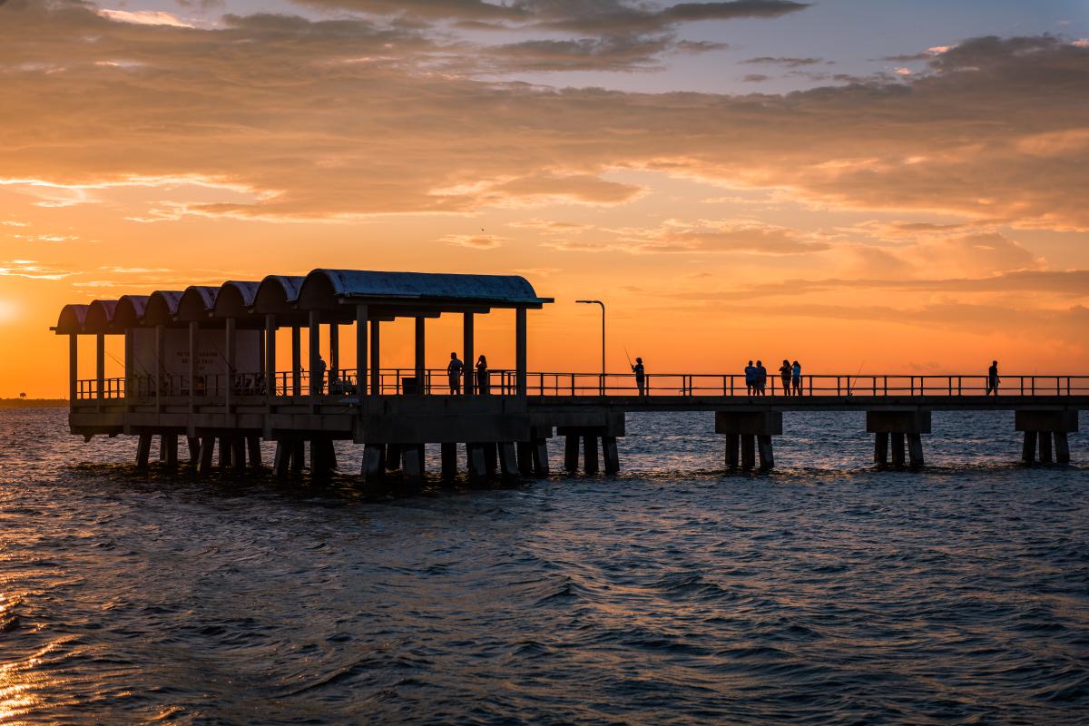 The sun sets behind the popular Jekyll Island Fishing Pier