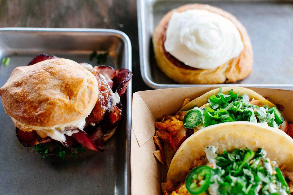 A monster egg sandwich, hand-rolled cinnamon roll and tasty breakfast tacos at DV8 Kitchen.