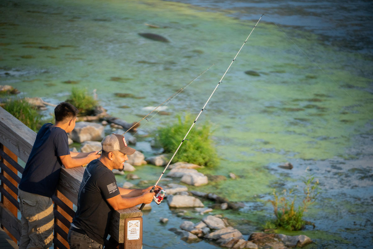 Two men fishing on Lake Waubesa