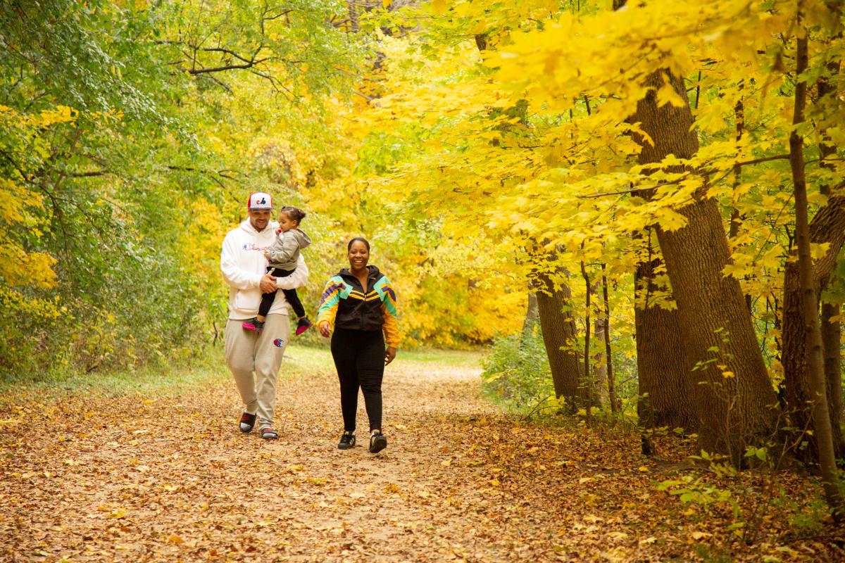 A family out for a hike during the fall months
