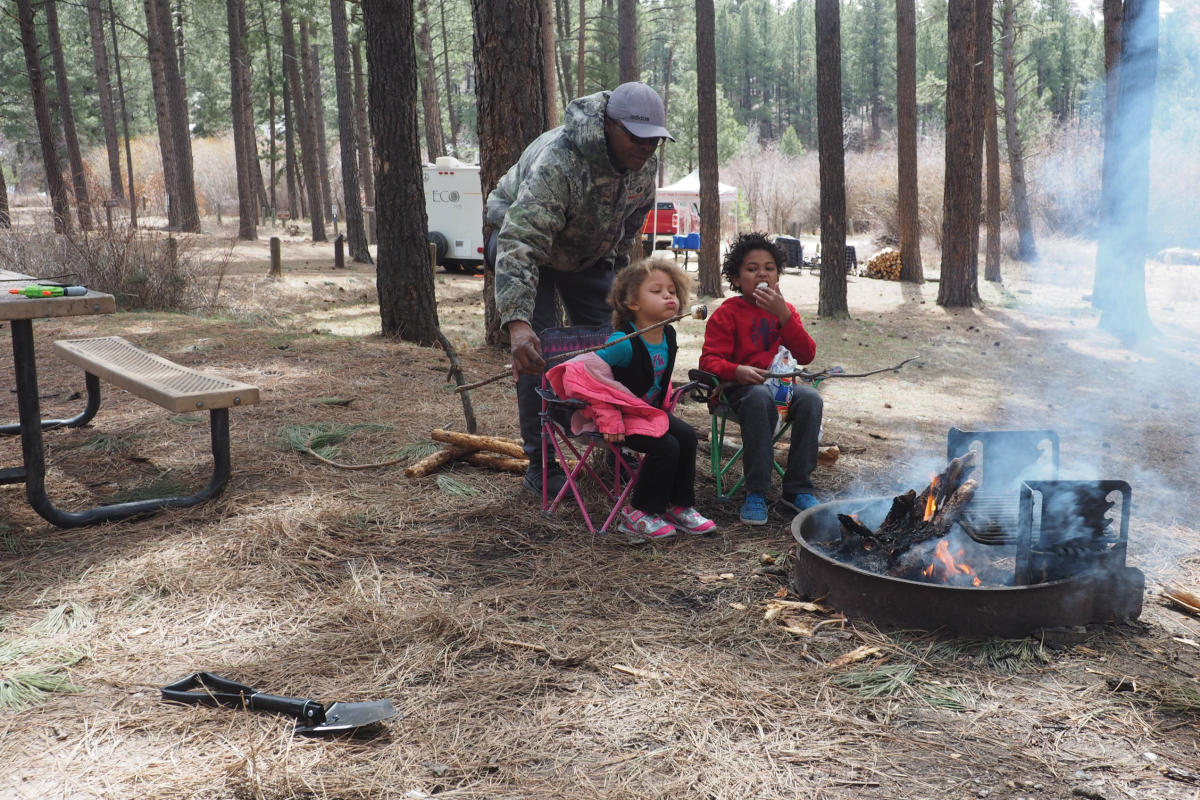 A family from Rio Rancho roasts marshmallows at their Fenton Lake campsite.