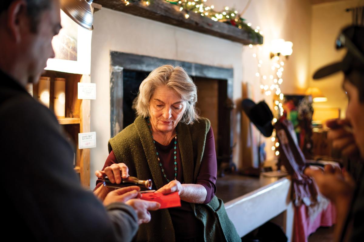 Jane Darland ours a sample of balsamic vinegar.