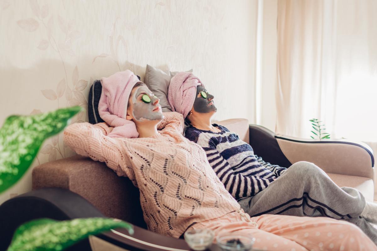 Mother and daughter pampering at home