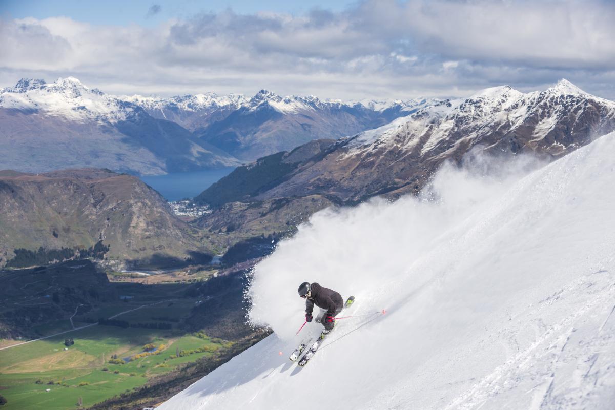 Man Skiing at Coronet Peak with beautiful views over Queenstown