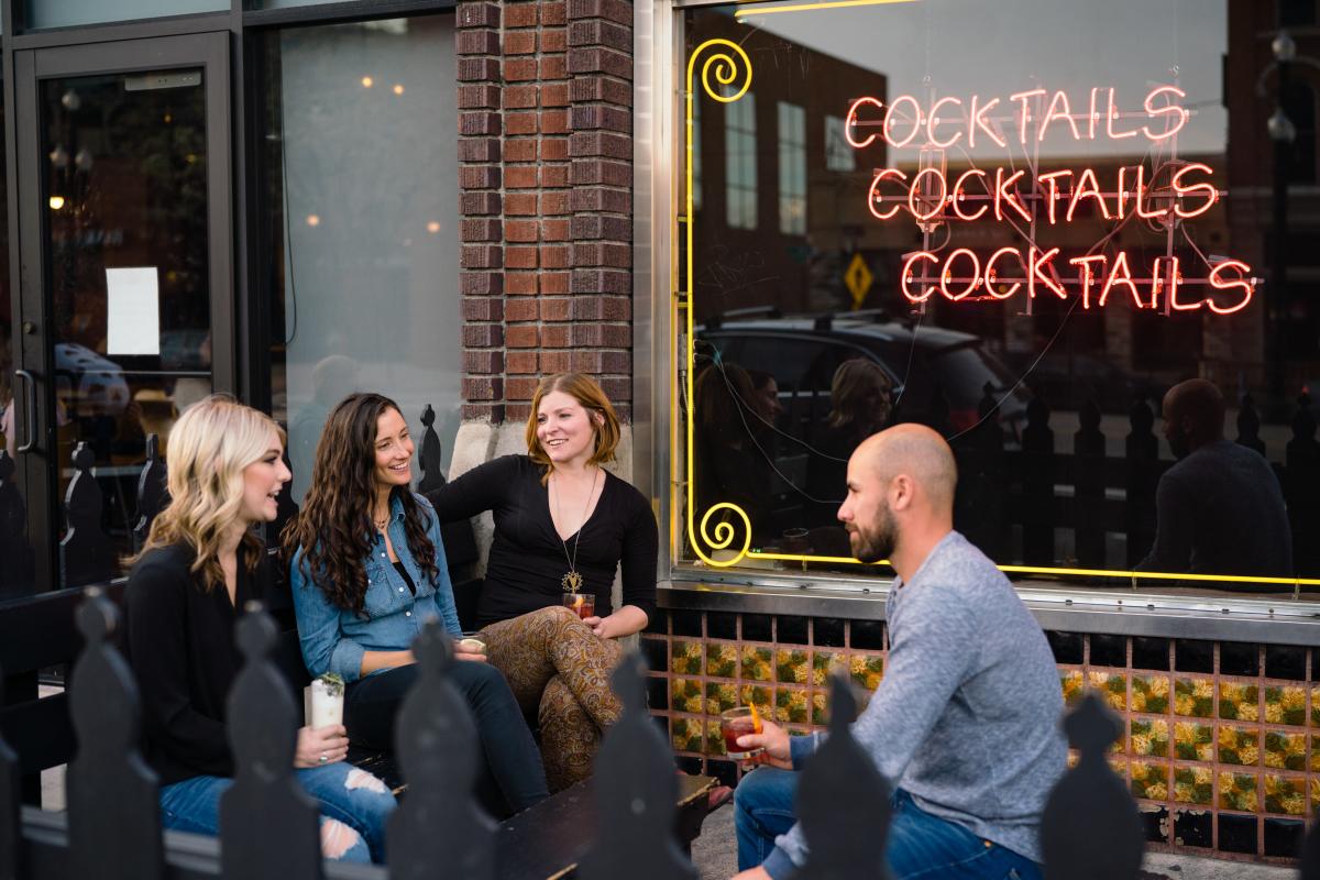 Friends drinking outside Bar X in downtown Salt Lake