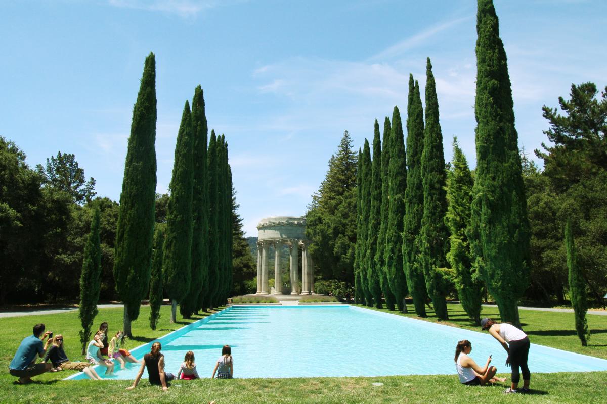 Visitors dip their feet in a pool at the Pulgas Water Temple in Woodside, CA.