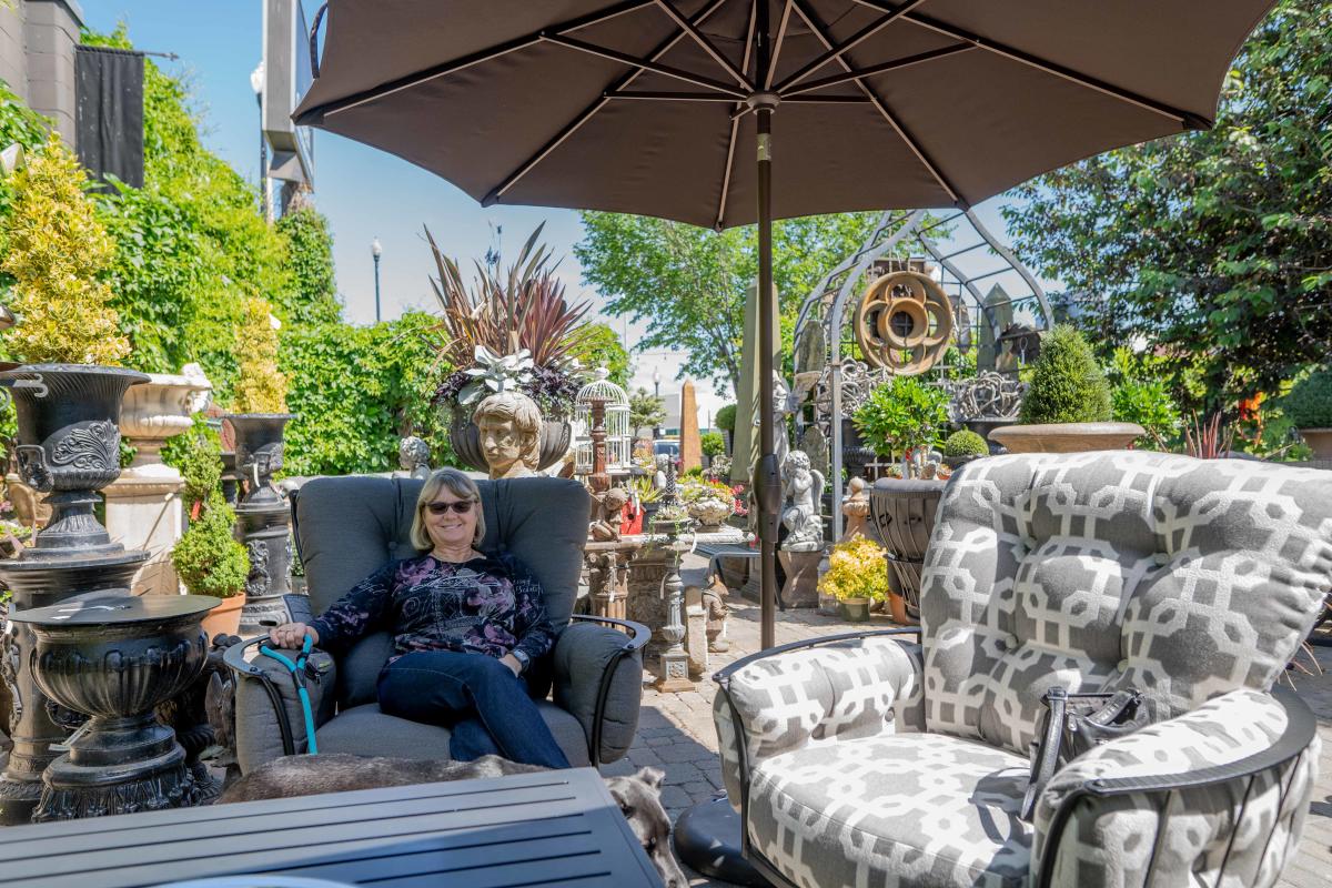 Woman Sitting in Lounge Chairs at Garden Architecture & Design in Saskatoon