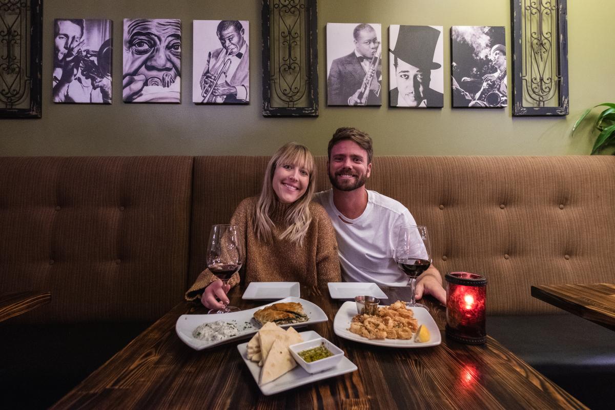 Smiling couple at the Black Trumpet in Huntington Beach