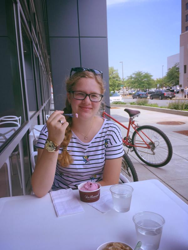 Eva, 13, stops on her bike ride in downtown Fort Wayne to enjoy a gelato at DeBrand Fine Chocolates on Harrison Street.