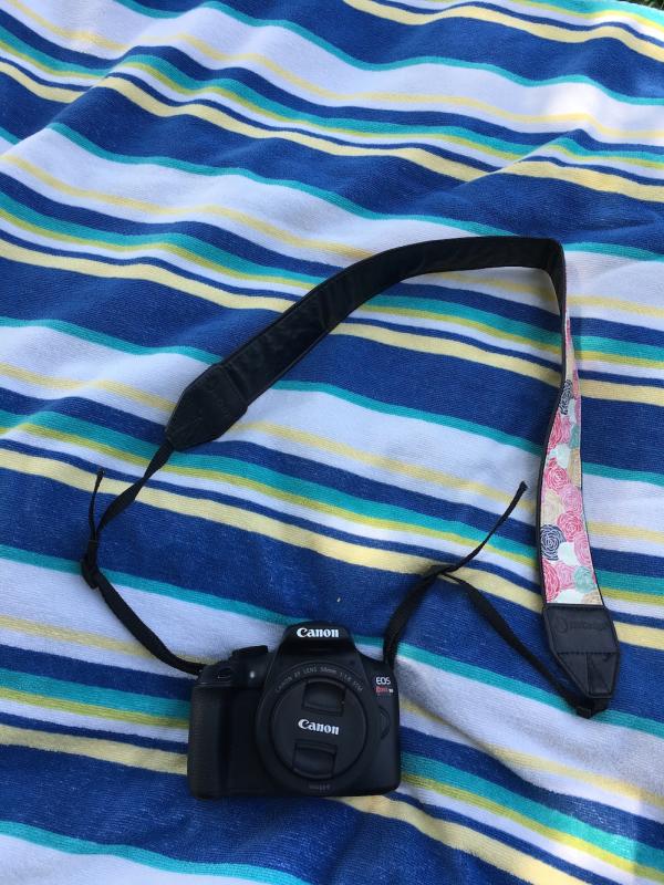 Camera on beach towel for day trip to Big Falls
