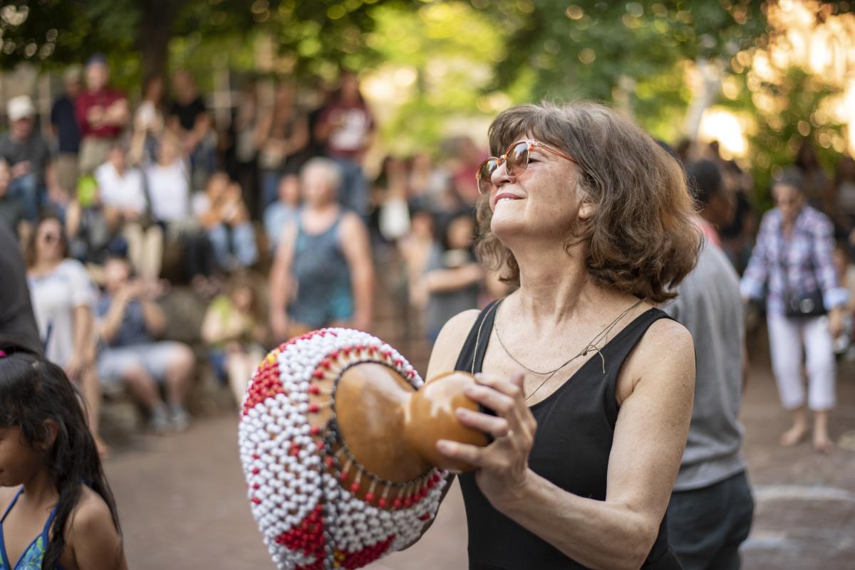 Woman dancing at drum circle in Asheville, N.C.
