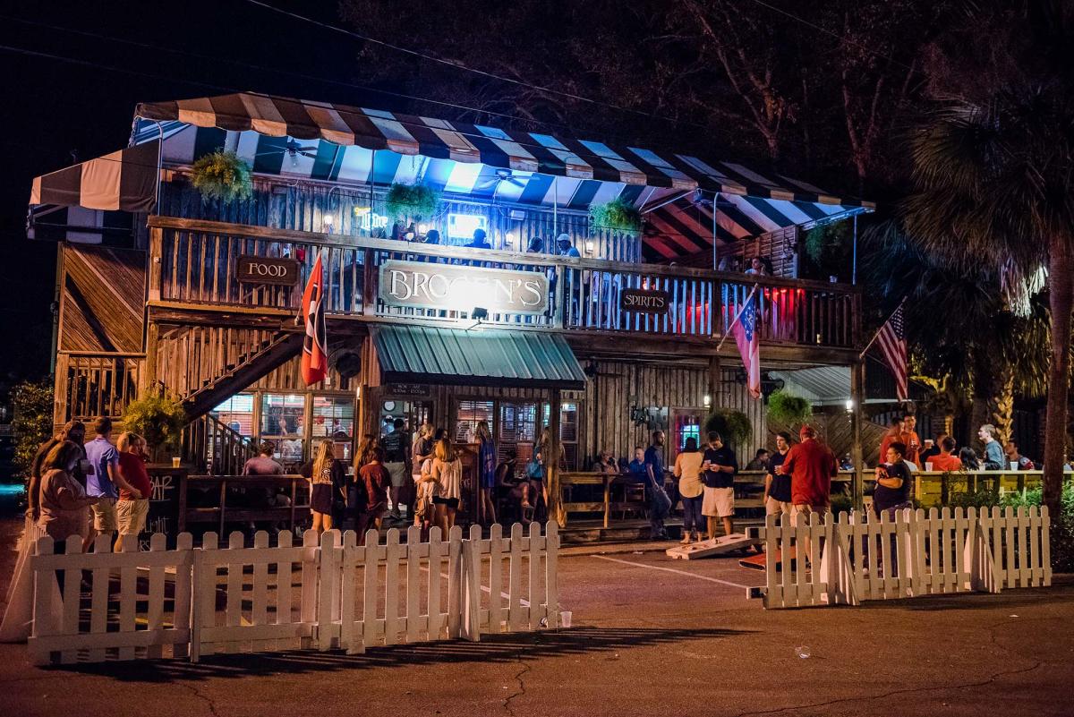 Patrons gathered for outdoor drinks and food at Brogen's South on St. Simons Island, GA at night