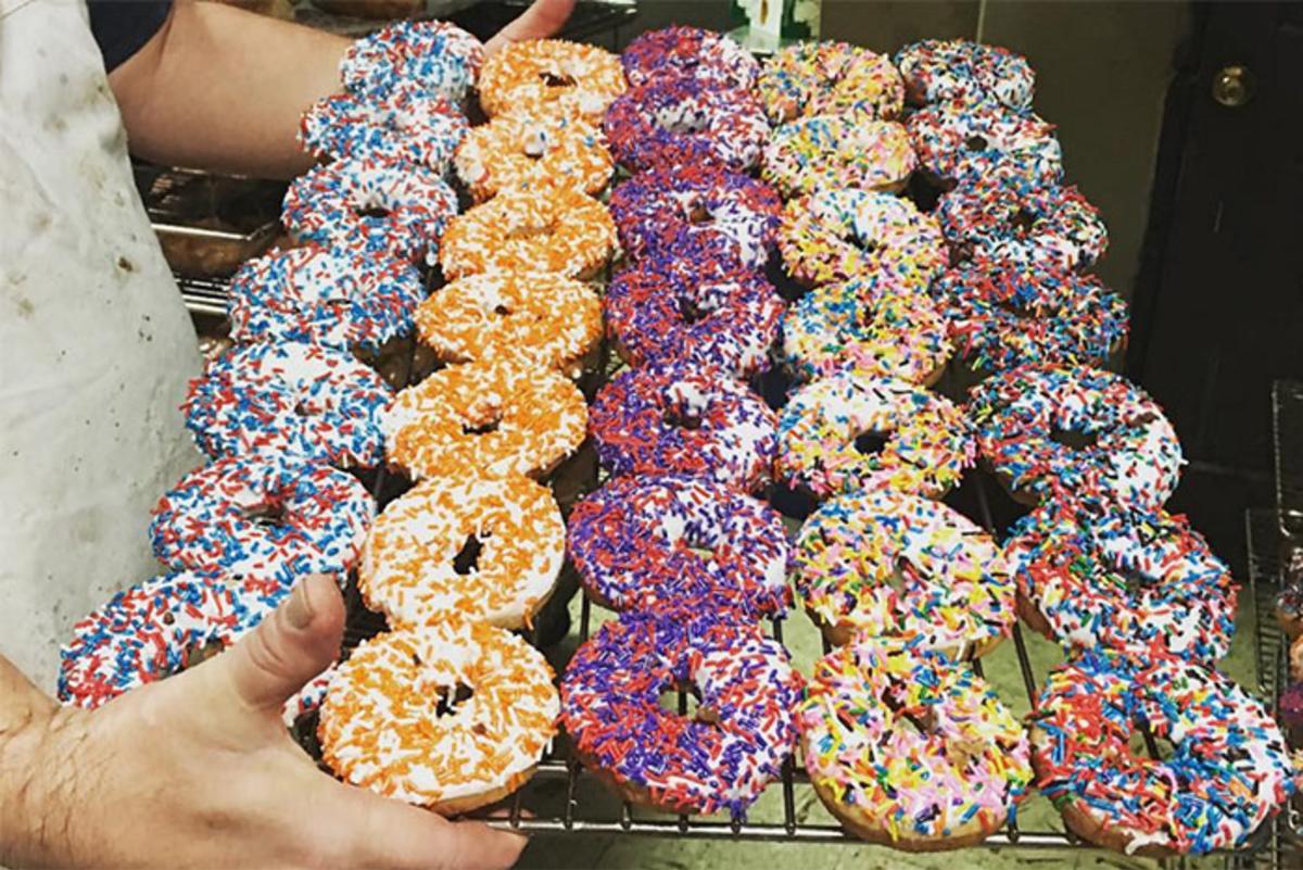 Tray of colorful donuts