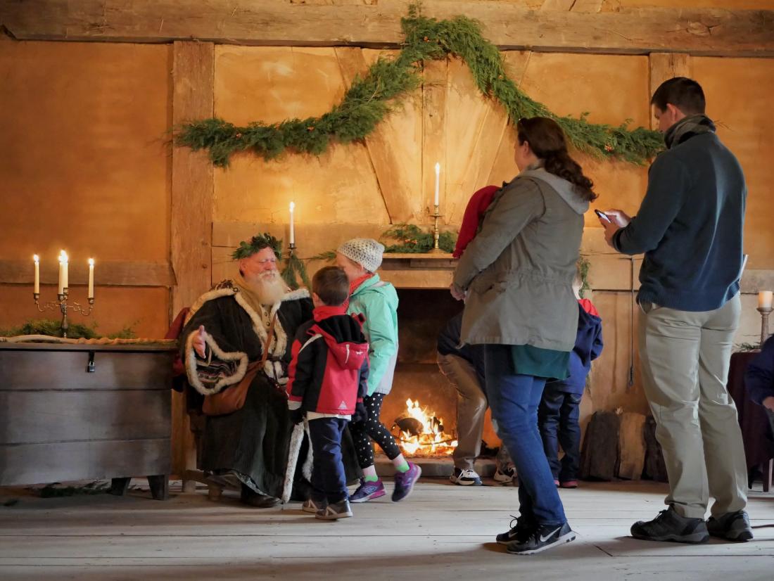 Henricus Historical Park Father Christmas greeting a family