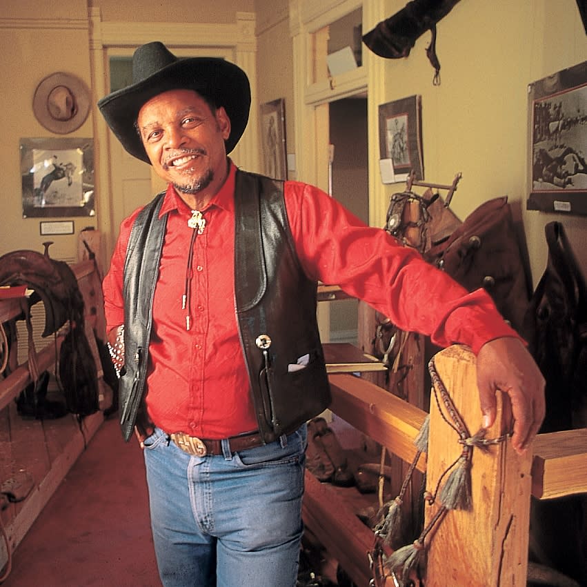 A local cowboy poses inside the Black American West Museum.