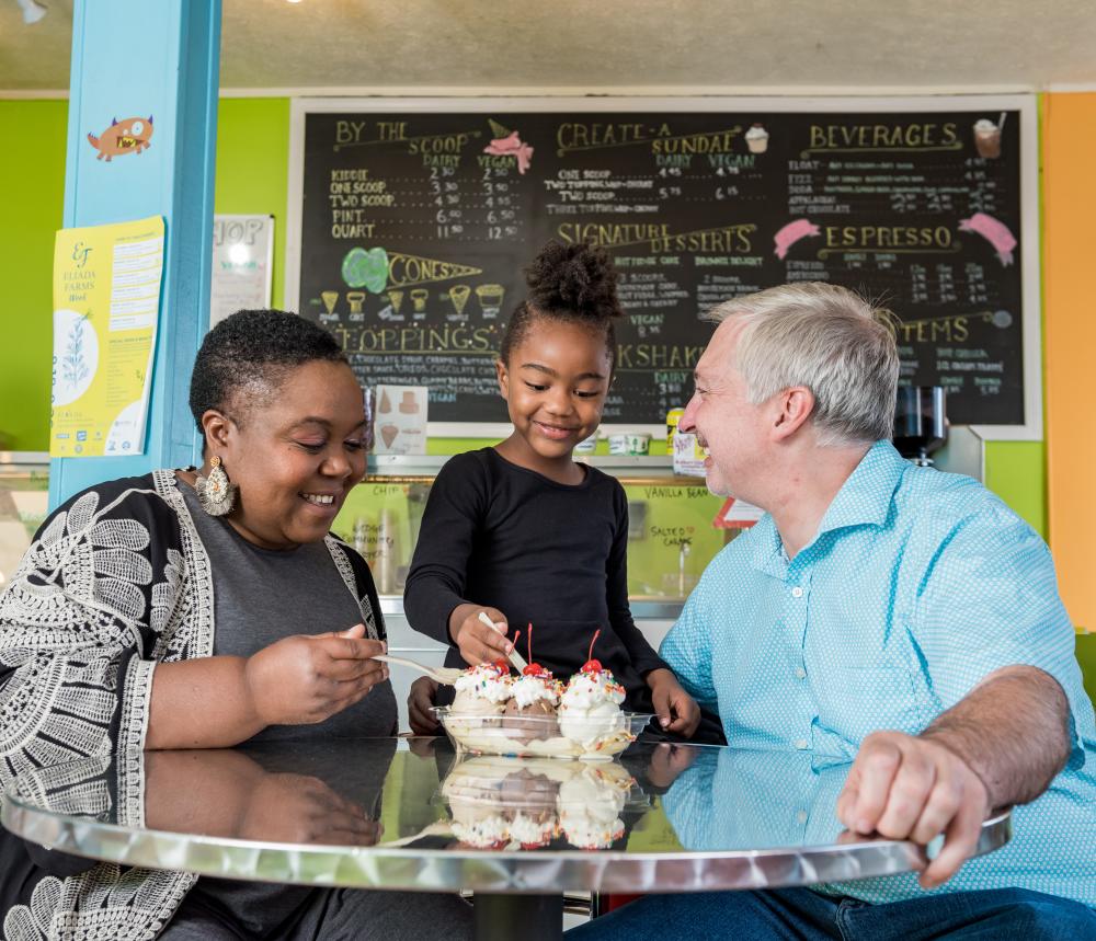 A family enjoys delicious ice cream at The Hop Ice Cream Cafe in Asheville, NC