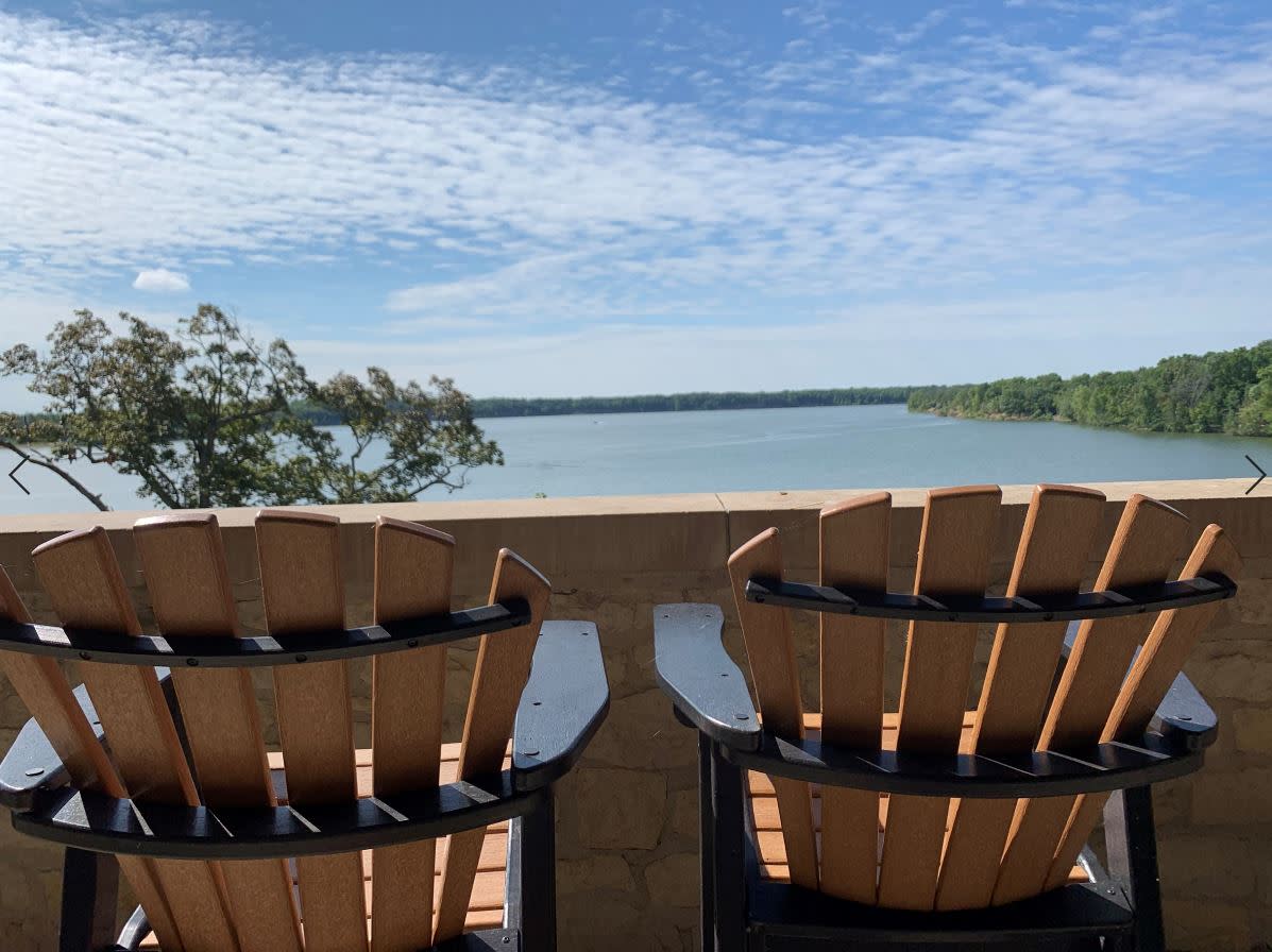 Water view over Adirondack chairs at Deer Creek