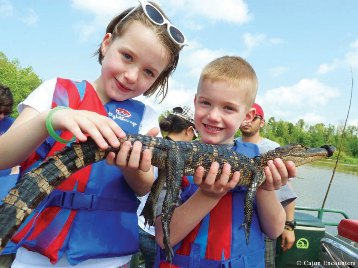 Kids with gator photo credit Cajun Encounters