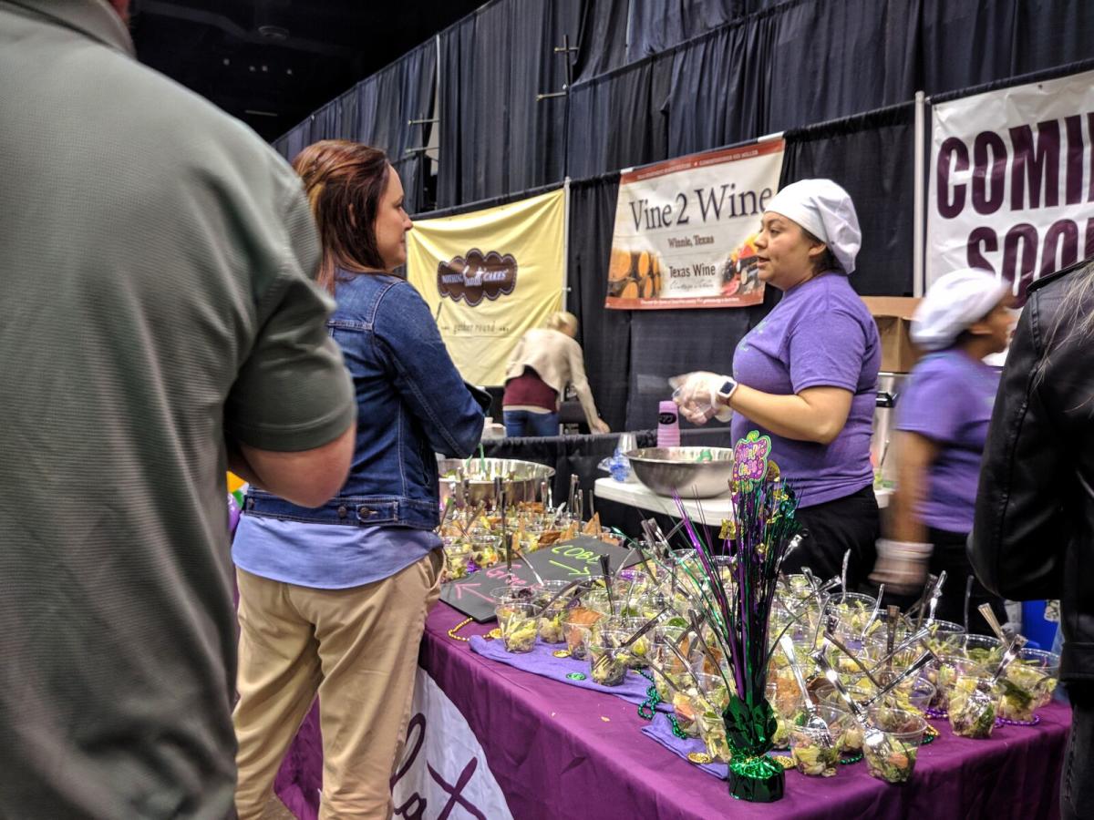 Food vendor providing food samples at Taste of the Triangle In Beaumont, TX