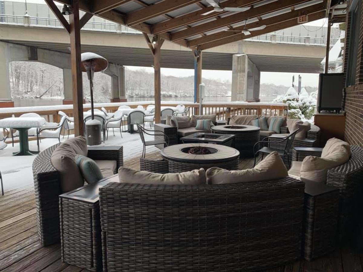 couches and firepit at Madigan's Waterfront