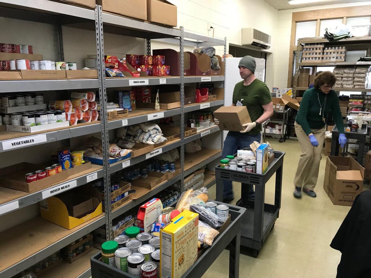 Salvation Army stocking shelves