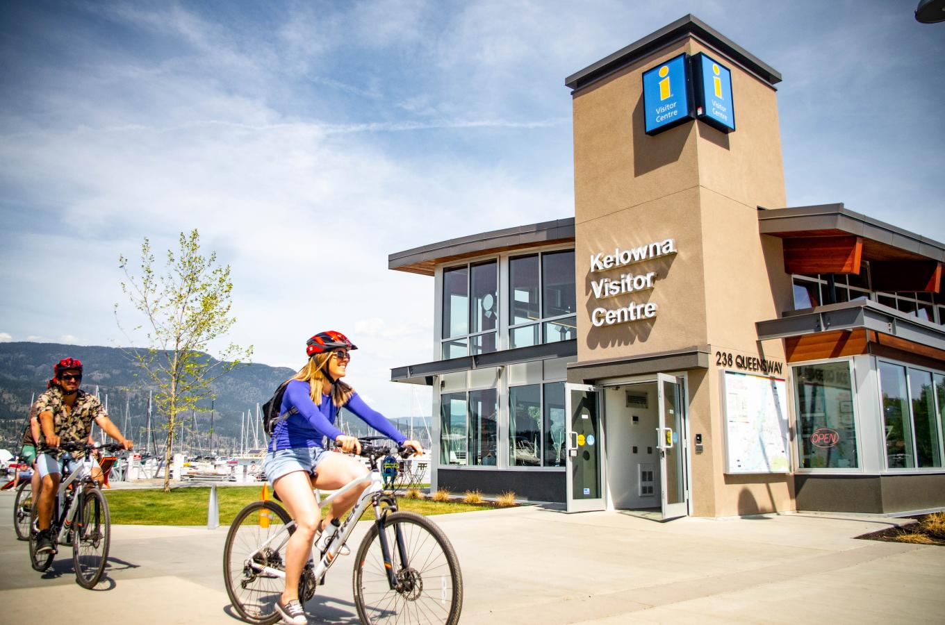 Biking in front of the Kelowna Visitor Centre