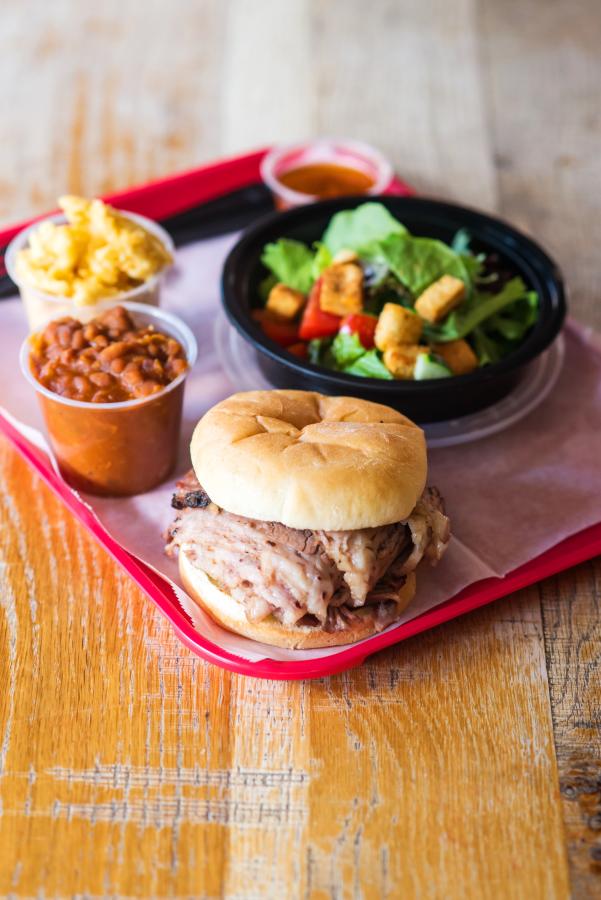 Tray with BBQ sandwich, beans, salad at the Black Hog 17